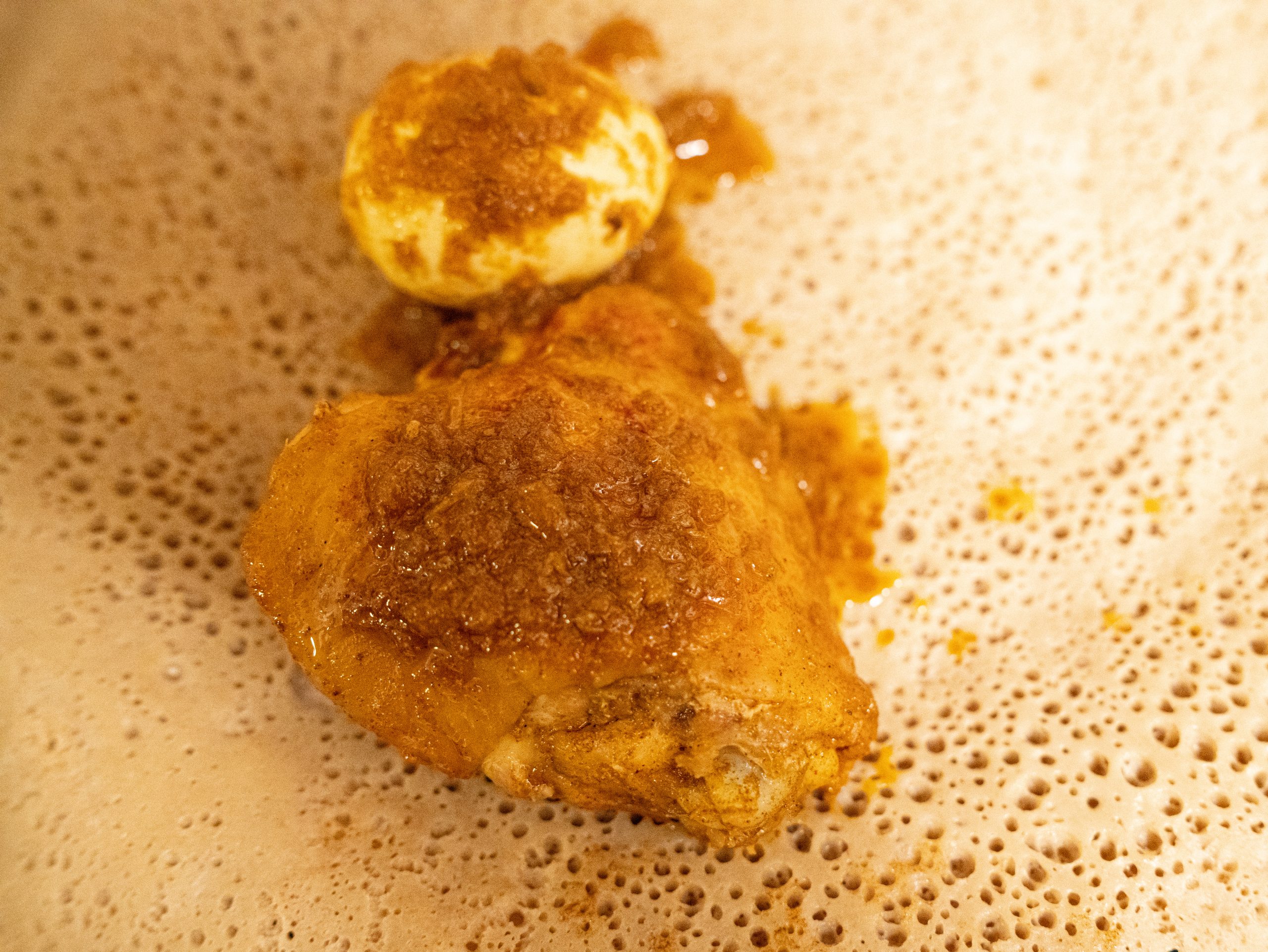 Doro wat, Ethiopian chicken stew with a boiled egg, served on injera